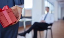 Businessman going to give present to his boss
